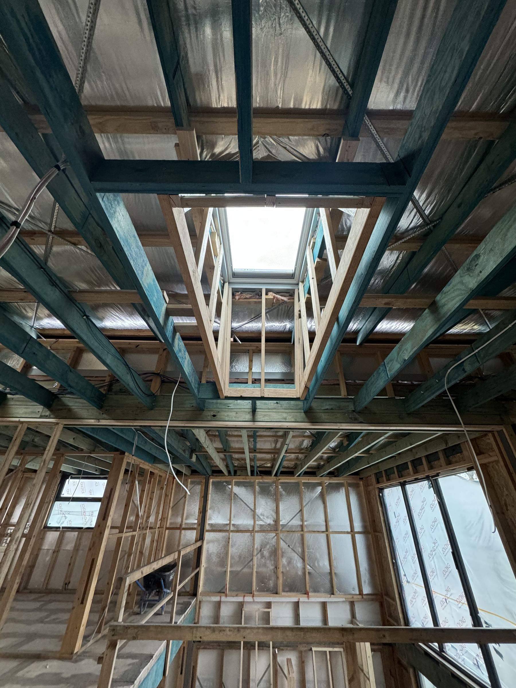 Looking up at a skylight framed into the roof structure